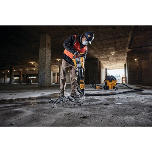 SDS MAX Demolition hammer being used by person SDS MAX Demolition hammer being used by person