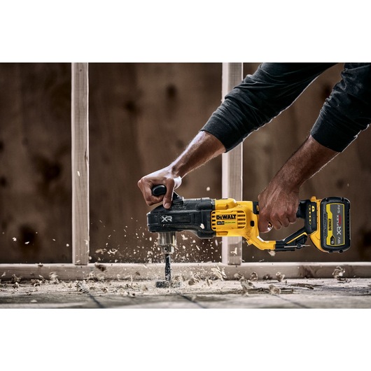 18V Brushless Compact Stud and Joist Drill drilling through floorboards