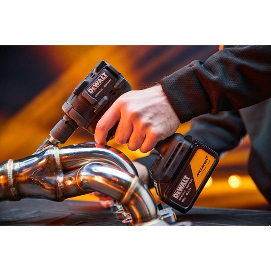 DEWALT x McLaren F1 Team 18V XR Special Edition Compact Impact Wrench with 5Ah battery in application