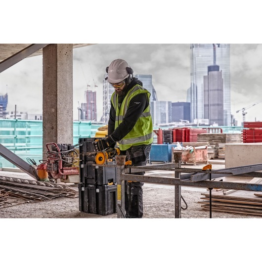 6 INCH CORDLESS GRINDER WITH KICKBACK BRAKE being used on wall