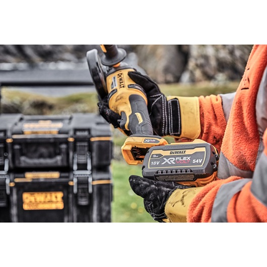 6 INCH CORDLESS GRINDER WITH KICKBACK BRAKE being attached with the battery