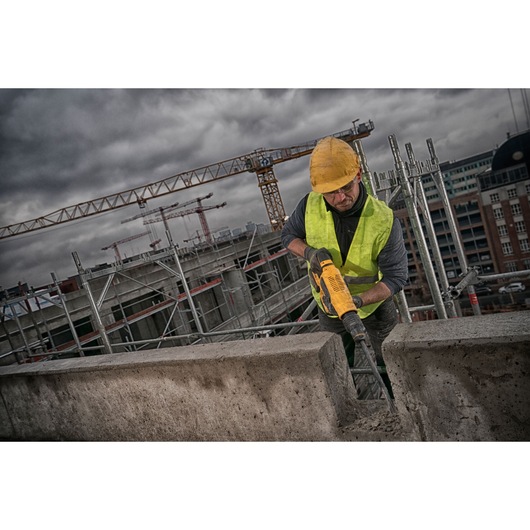 Brushless SDS MAX combination rotary hammer being used by a person