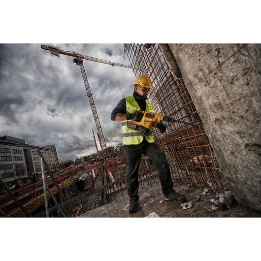 Brushless SDS MAX combination rotary hammer being used by a person