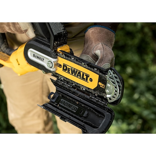 Open safety guard on an 18V XR Brushless Chain Saw