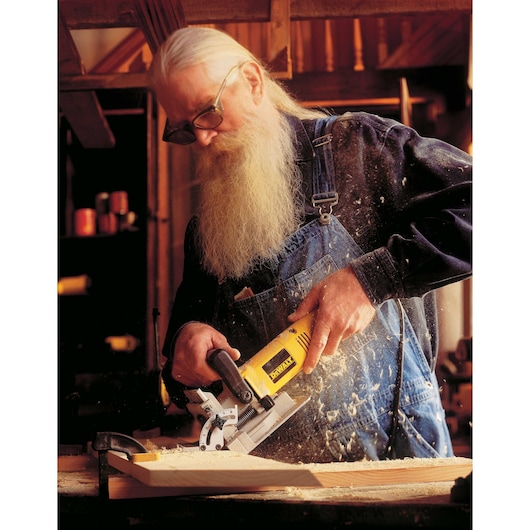 Plate Joiner Kit being used by a person on wood. Plate Joiner Kit being used by a person on wood.