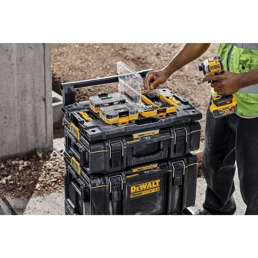 A stack of TOUGH SYSTEM 2.0 cases connected to TSTAK case using adapter plate A stack of TOUGH SYSTEM 2.0 cases connected to TSTAK case using adapter plate