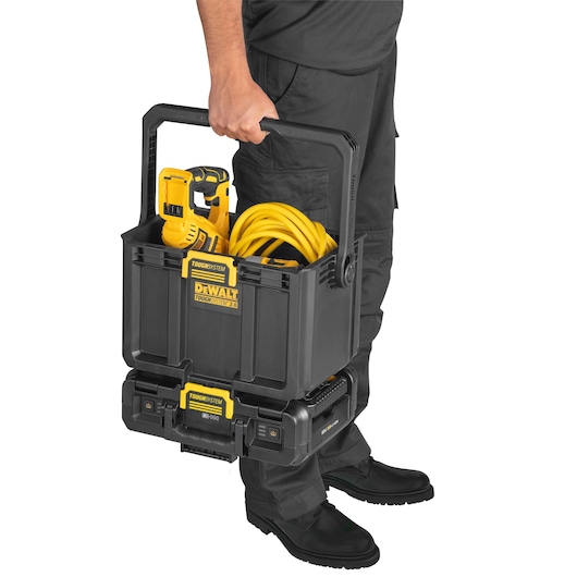 Cordless Adjustable Work Light and Storage being carried by anti-tilt handle showcasing tools being stored easily
