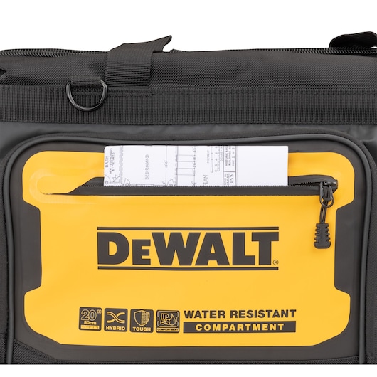 A set of plans is slotted into the water resistant compartment on the Dewalt 20" Pro Open Mouth Tool Bag"
