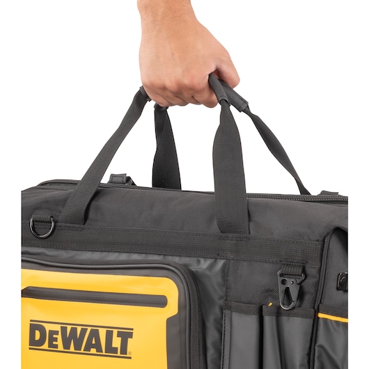 Dewalt 20" Pro Open Mouth Tool Bag being carried"